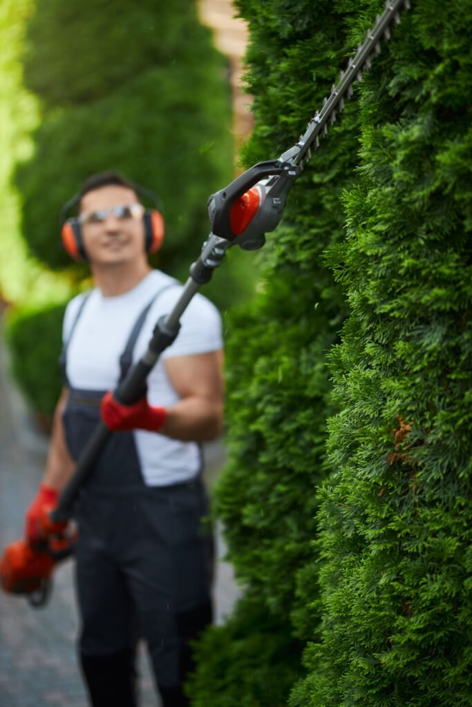 man-uniform-trimming-hedge-summer-time(1)